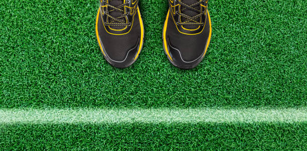 istock White stripes and man shoe on the grass floor 868422772