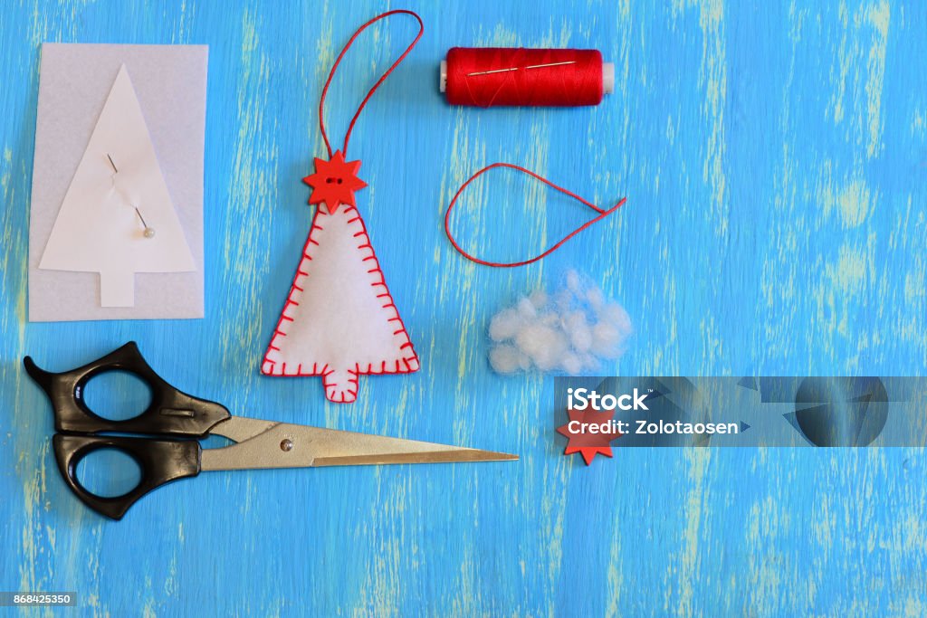 Homemade Felt Christmas Tree Paper Template Felt Thread Needle Pin Scissors  On A Wooden Background With Copy Space Set For Christmas Decoration Sewing  Creativity For Kids Tutorial Top View Stock Photo 