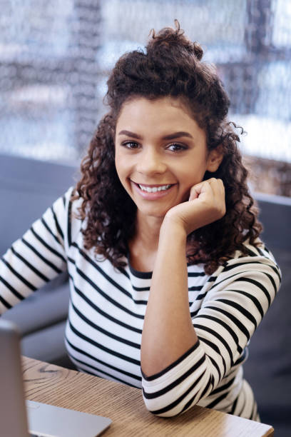 istock Pretty girl sitting at the table 868430320