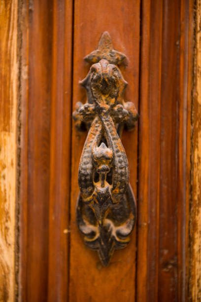 istock Rusty vintage door handle on a wooden door 868432924