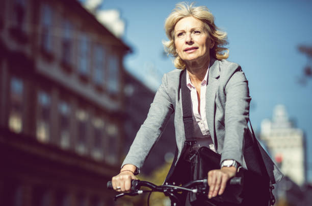 istock Mature Businesswoman Commuting on Bicycle 868433566