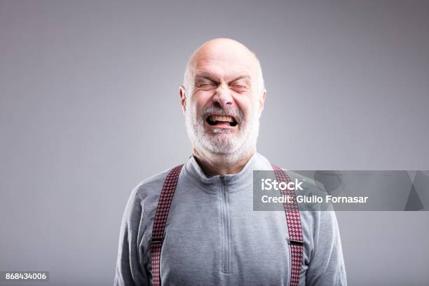 Exaggerated Tearing Old Man Expression Stock Photo - Download Image Now - Men, Human Face, Squinting