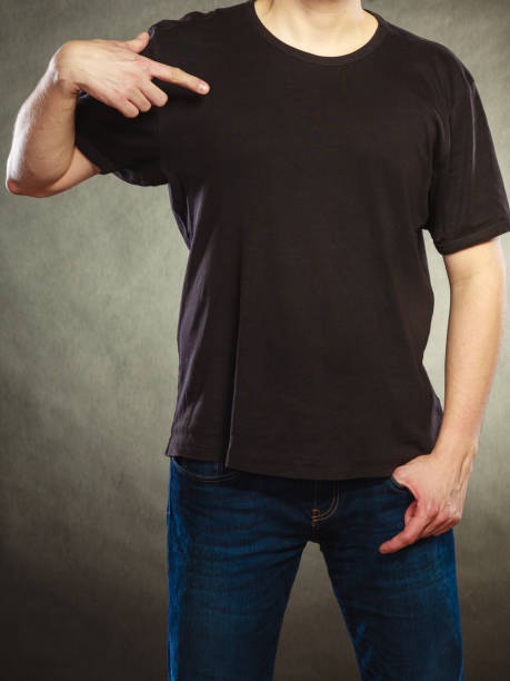 istock Man guy in blank shirt with copy space pointing. 868434134