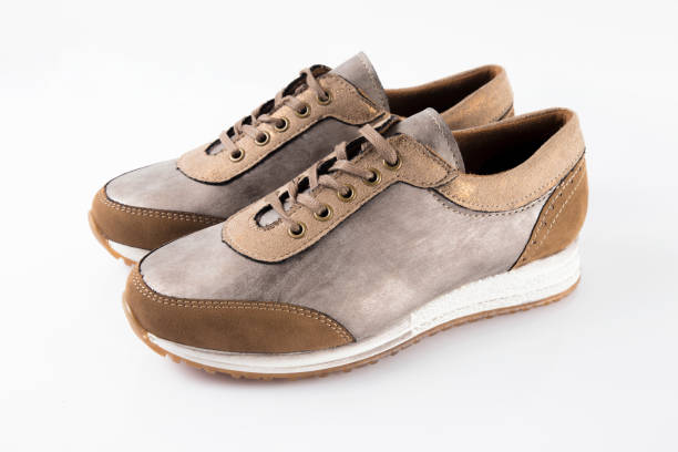 istock Female Brown leather sneaker on white background. 868436618