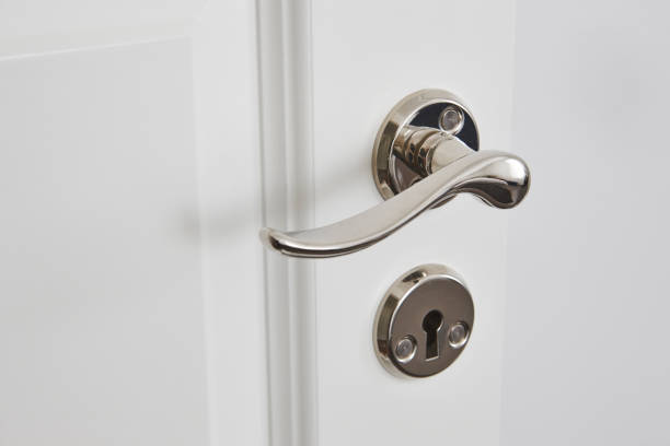 istock Metallic classic door knob on a white door. Closed 868436762