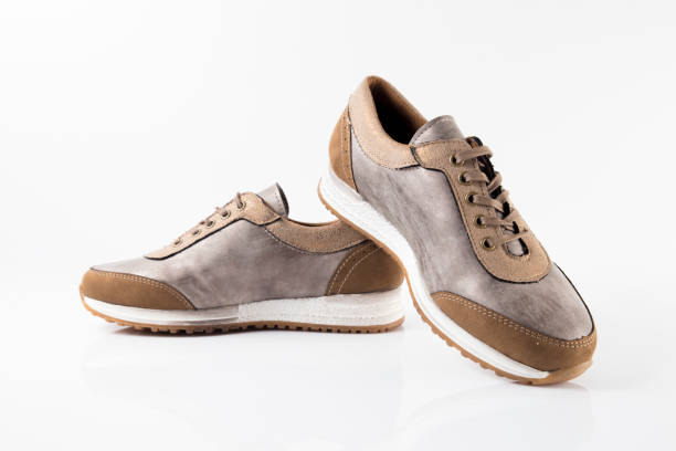 istock Female Brown leather sneaker on white background. 868437380