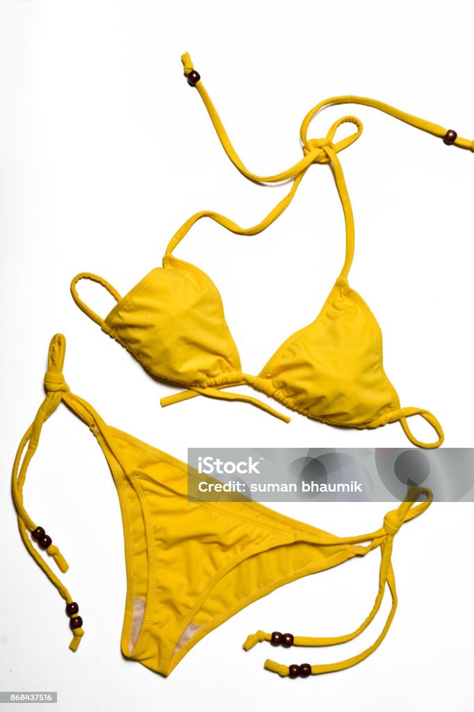 Yellow bikini Yellow bikini on white background Bikini Stock Photo