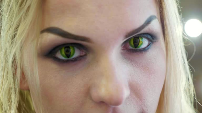 Close-up portrait of young pretty woman with halloween makeup at beauty salon