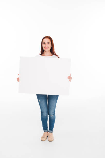 istock girl holding empty card 868439286