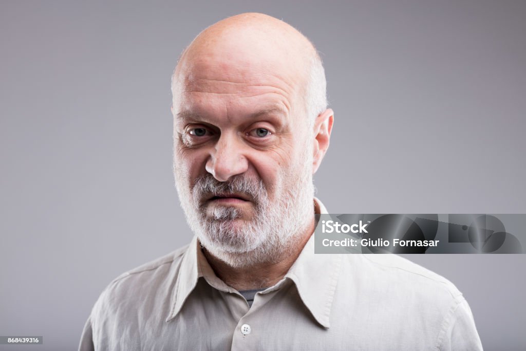 old bald man disgusted and disappointed that's not good at all says this old bald man disgusted and disappointed Displeased Stock Photo
