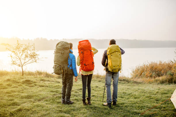 istock Hikers with backpacks outdoors 868439570