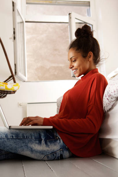 istock Attractive young woman working from home on laptop 868441972