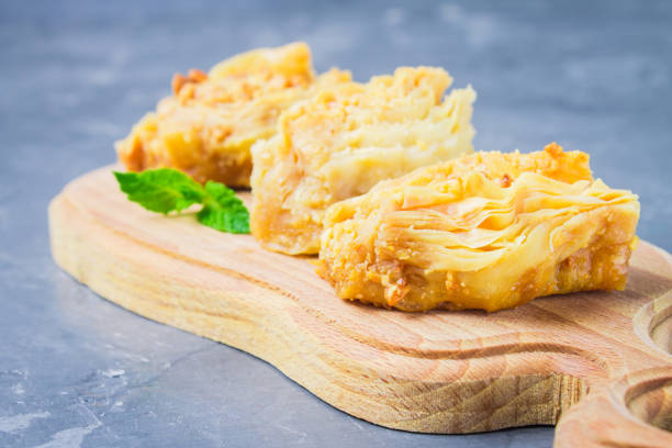 istock baklava turkish traditional delight on a dark wood background. toning 868442990
