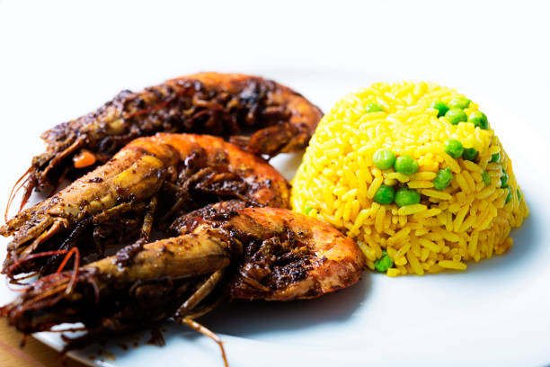 Prawns with yellow rice and peas on a plate