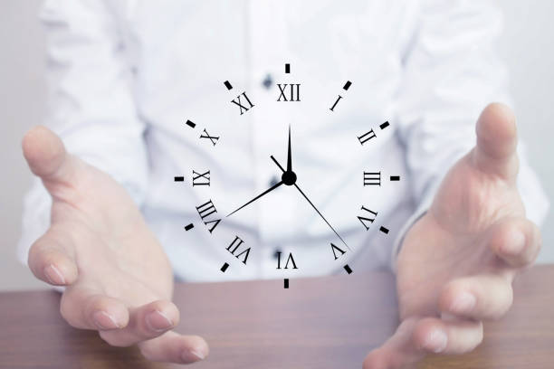 istock Businessman holding clock. Business time management . 868446186