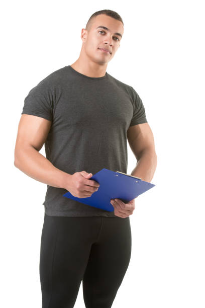 istock Personal Trainer, with a pad in his hand, isolated in white 868446724