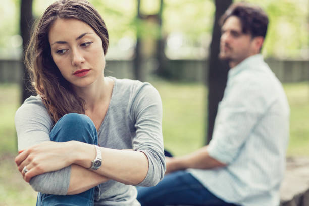istock Young couple sitting apart from each other 868446824