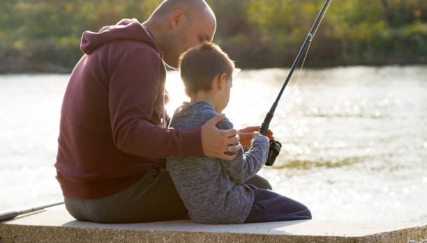 istock Father and son fishing 868447460