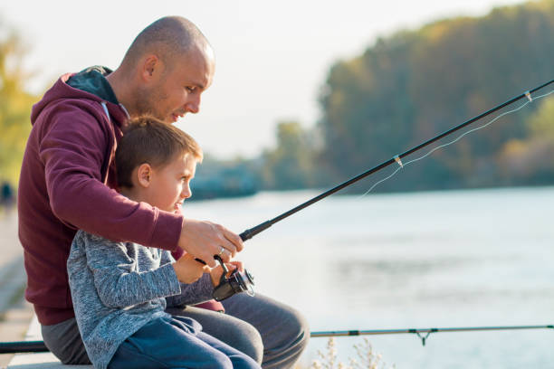 istock Father and son fishing 868450062