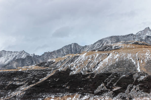 istock snow mountain with grassland in winter 868451160