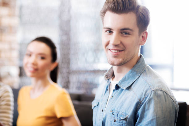 istock Good-looking dark-eyed young man smiling 868454162