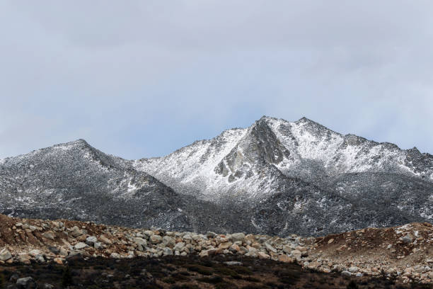 istock snow on mountain peak in cloudy day 868454724