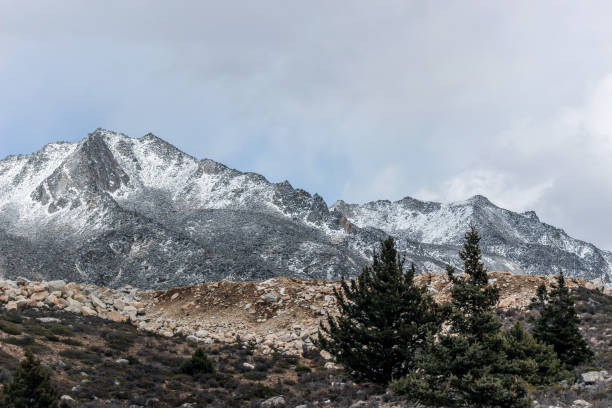 istock snow on mountain peak in cloudy day 868454830