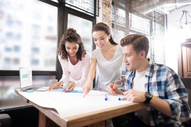 istock Glad man and two ladies working and designing 868455326