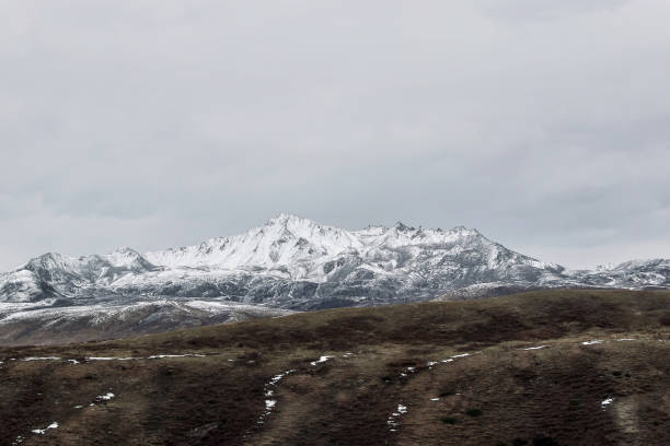 istock snow mountain with grassland in winter 868457452