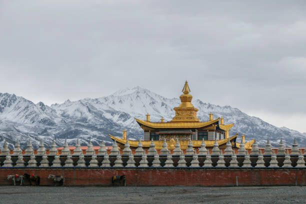 istock golden buddhist temple under snow mountain 868457718