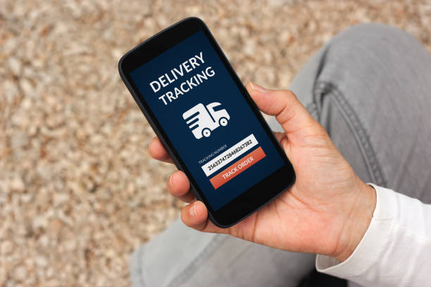 istock Hand holding smart phone with delivery tracking concept on screen 868457942