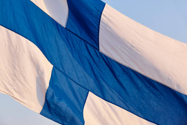 istock Finnish flag under a blue sky. Finland symbol. Europe. 868457982