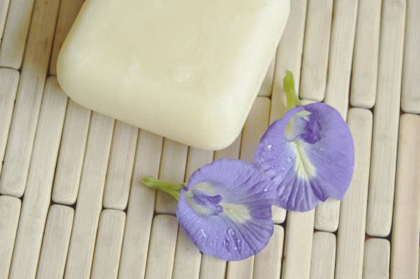 istock soap and blue pea on bamboo mat 868462326