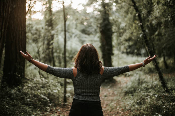 istock Young woman with arms raised 868465776