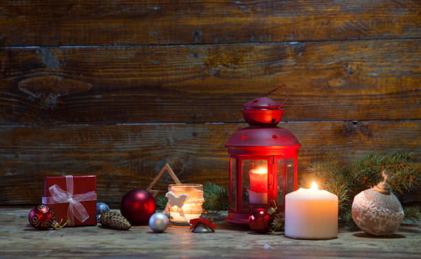 istock christmas Lantern with decorations on blue wooden background 868470272