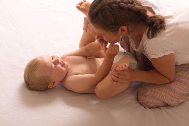 istock mom change baby diaper 868470618