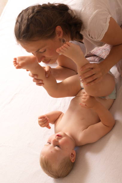 istock mom change baby diaper 868470716