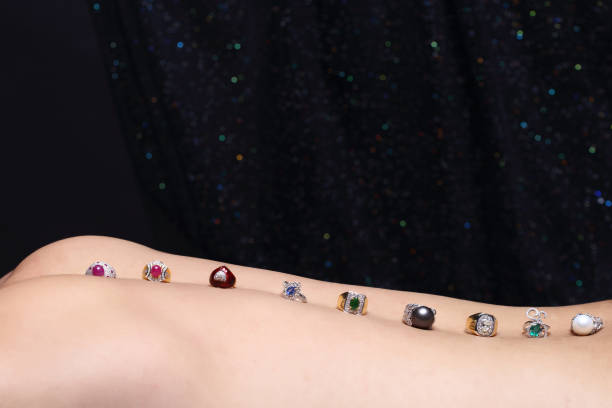 istock Gems, Jewelry, Daimond, Gold Silver, Ruby vavluable Rings presented put on Human Skin 868479752