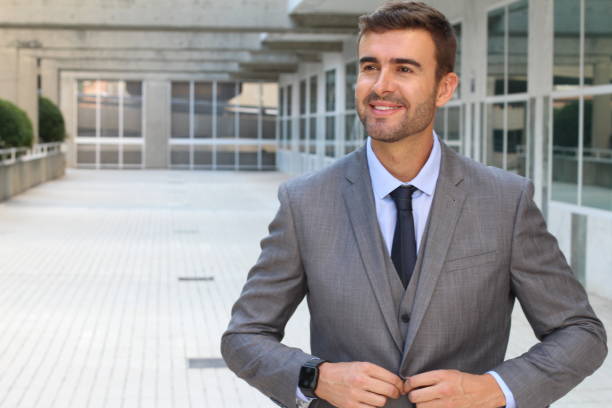 istock Elegant businessman adjusting his suit 868483820