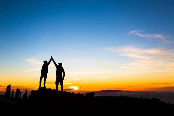 istock Couple hikers success concept in mountains 868490762