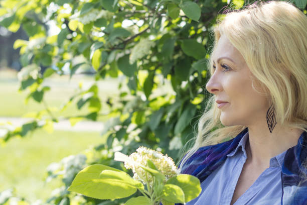 istock Pretty blond in the city park in spring 868498754