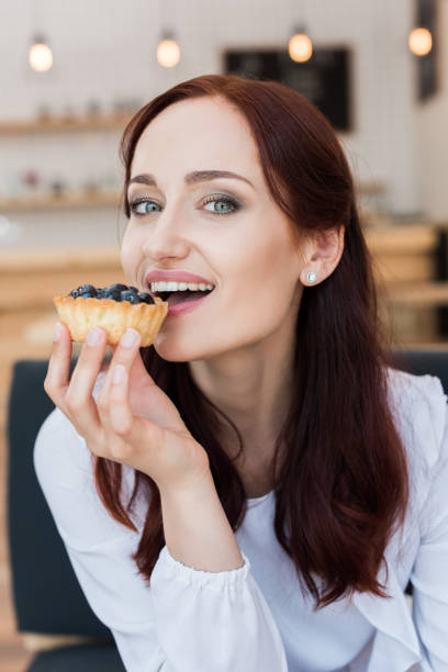istock woman eating delicious dessert 868500228