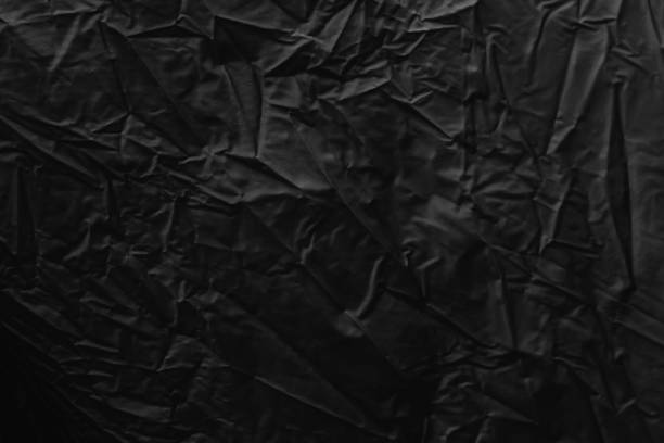 istock Black textured surface of fabric used for graphic resource 868500296