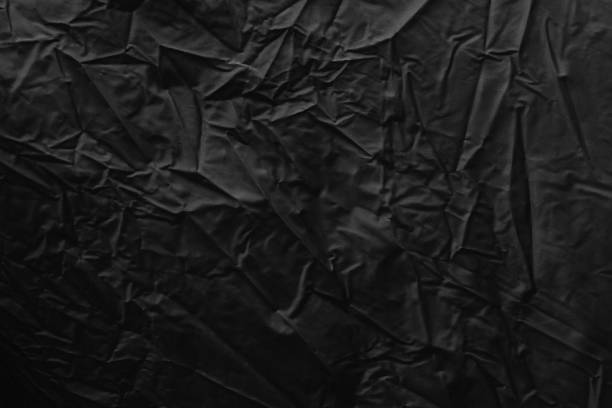 istock Black textured surface of fabric used for graphic resource 868501262
