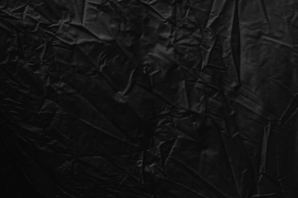 istock Black textured surface of fabric used for graphic resource 868502430