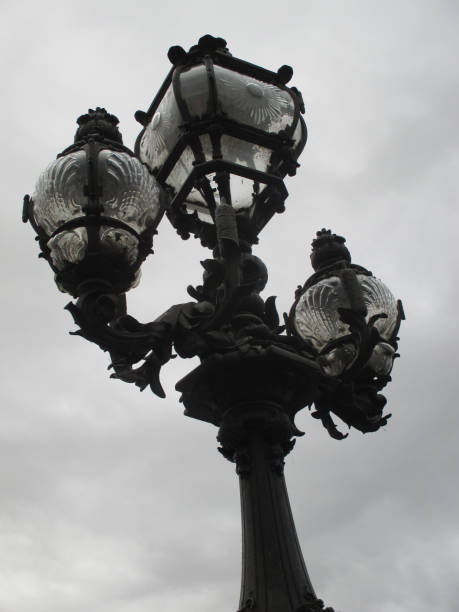 istock Lamppost on the Pont Alexandre 3 in Paris  Covered sky 868506578