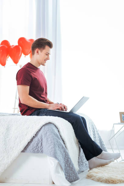 istock Happy gentleman in casual chatting with girlfriend on laptop 868507174