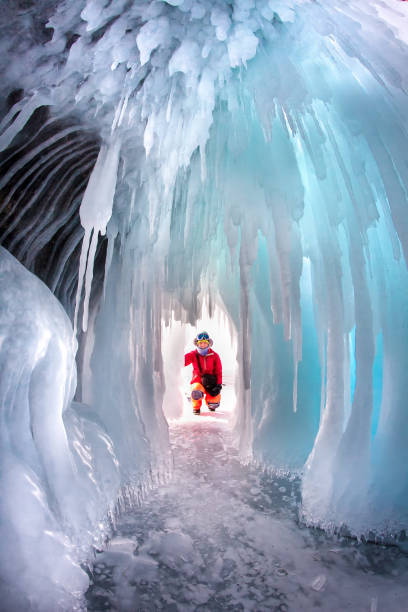 istock Man between the ice rocks on Lake Baikal on a clear day 868510538