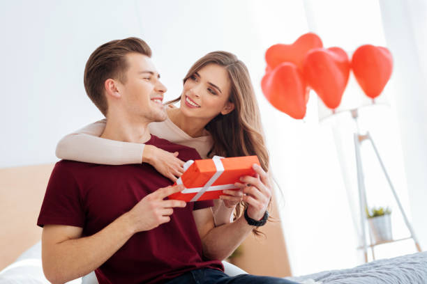 istock Charming couple celebrating their anniversary at home 868511374
