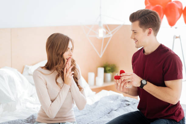 istock Loving boyfriend making proposal at home 868514648